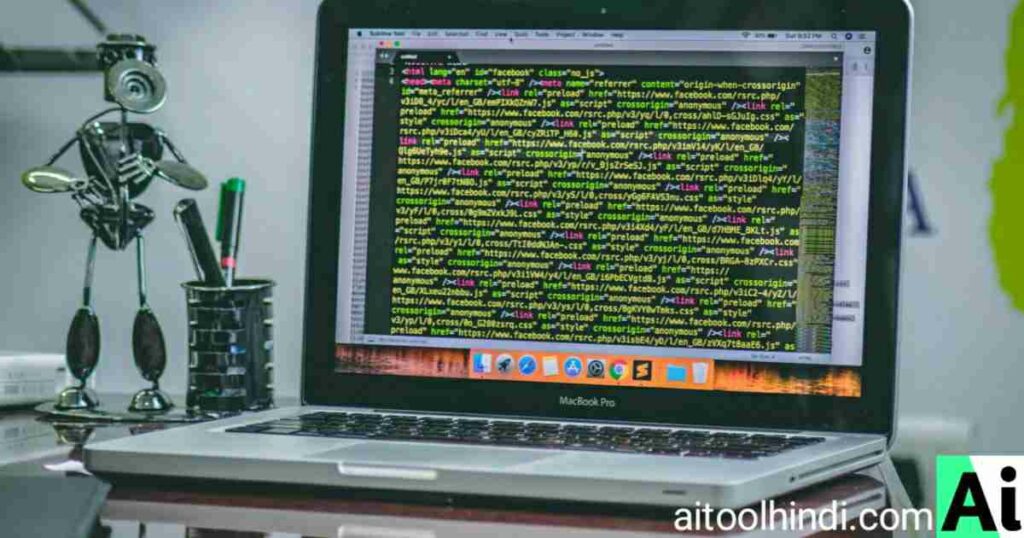 A robot figurine next to a MacBook displaying code on the screen, symbolizing AI software development.
