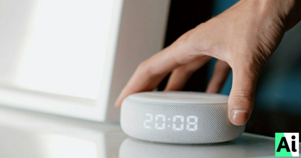 Hand adjusting a smart home assistant device with digital clock display